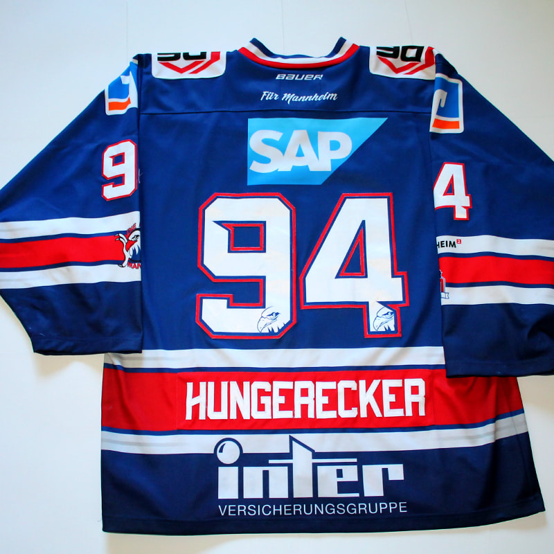 This jersey was game worn in his DEL rookie season by Phil Hungerecker