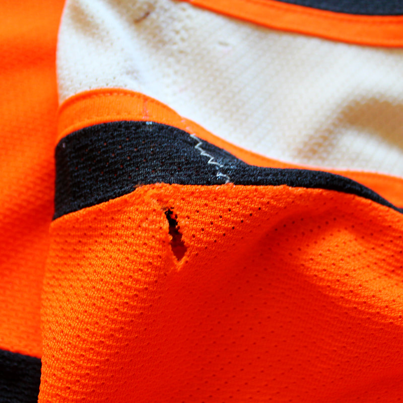 Holes on the Nick Schultz Philadelphia Flyers game worn jersey