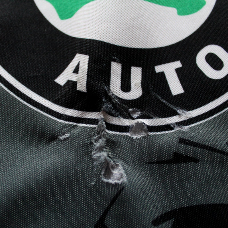 Holes on the game worn hockey jersey of Grizzly Adams Wolfsburg player Andreas Geisberger